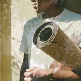 a person holding a yoga mat