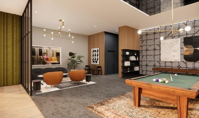 a room with a pool table and chairs