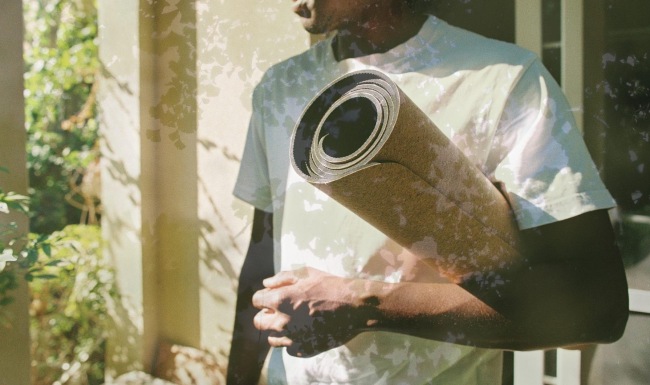 a person holding a mat