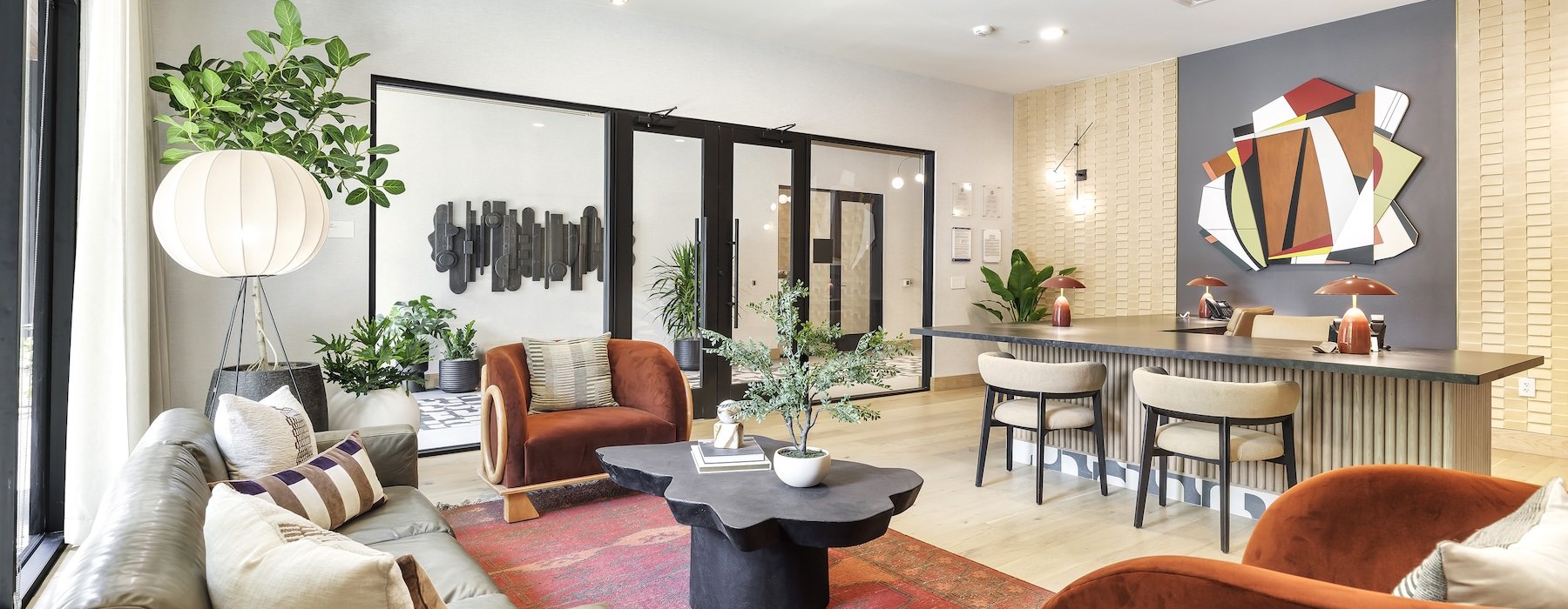 a spacious clubroom with natural lighting and ample seating
